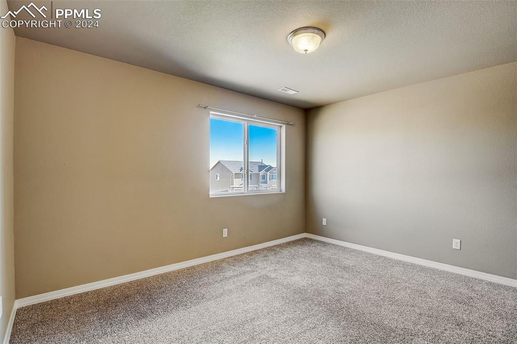 11642 Avena Road Peyton, CO 80831 - Photo 38 of 50 an empty room with a empty space and windows