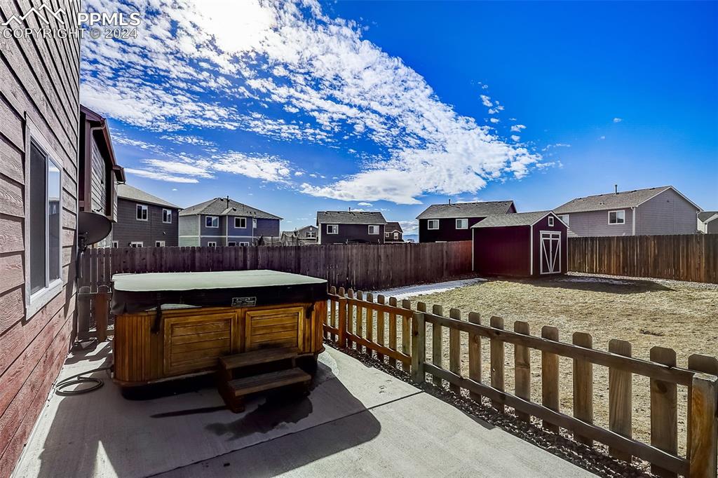 11642 Avena Road Peyton, CO 80831 - Photo 40 of 50 a view of a porch with furniture and a yard