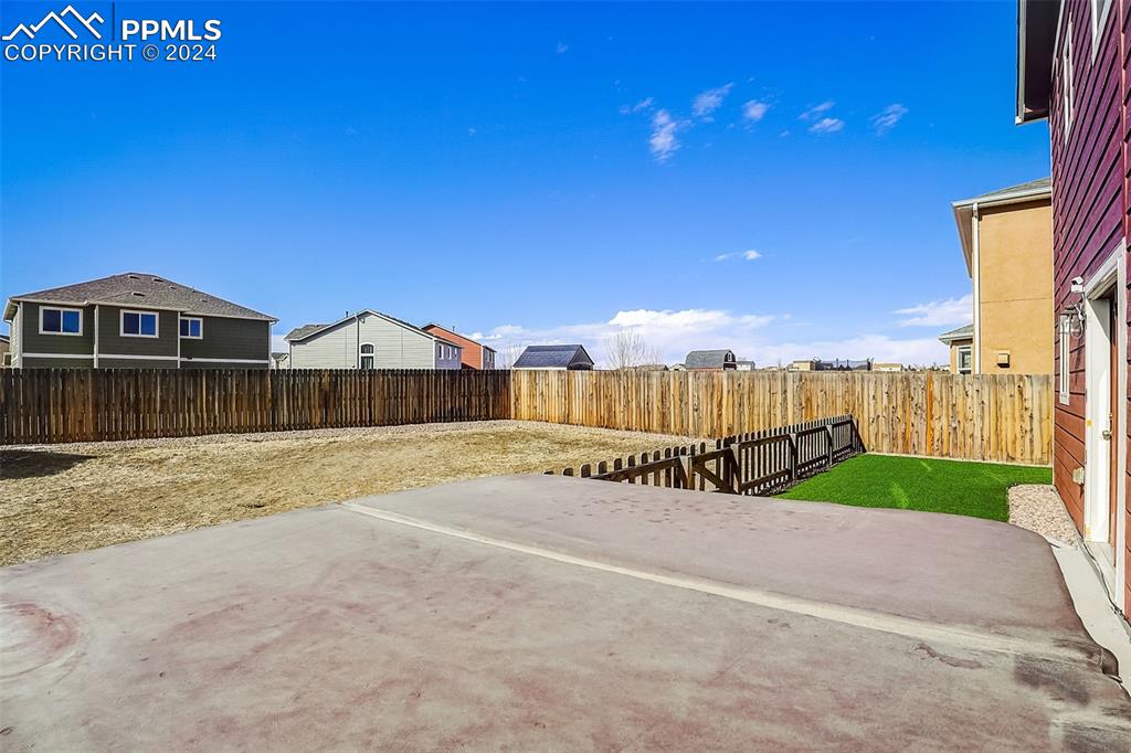 11642 Avena Road Peyton, CO 80831 - Photo 41 of 50 a view of a terrace with a garden
