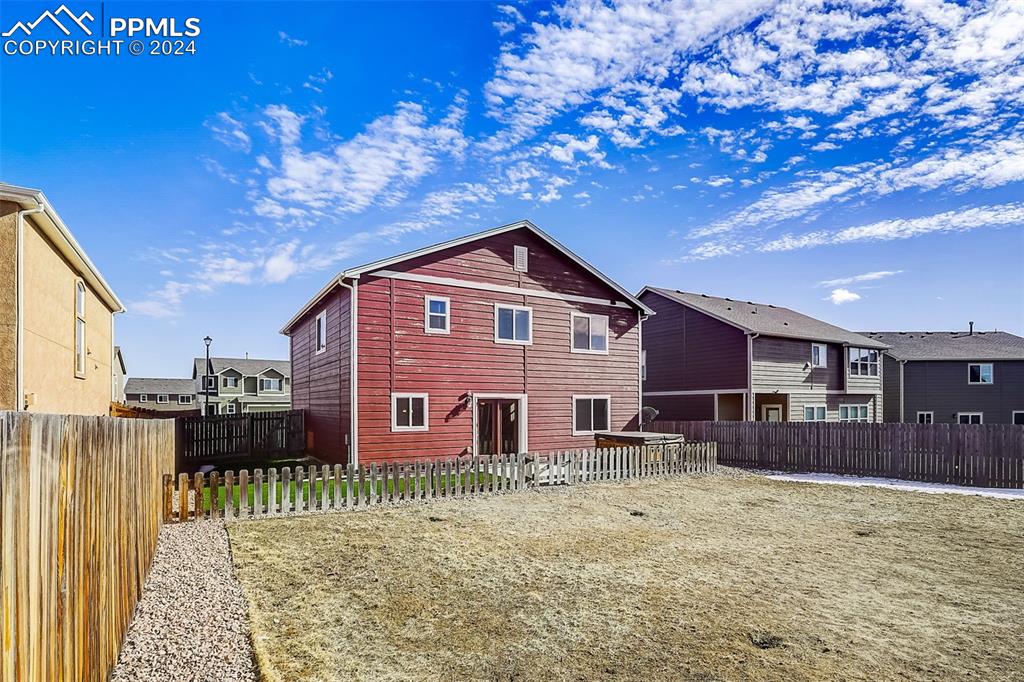 11642 Avena Road Peyton, CO 80831 - Photo 42 of 50 a front view of a house with a yard