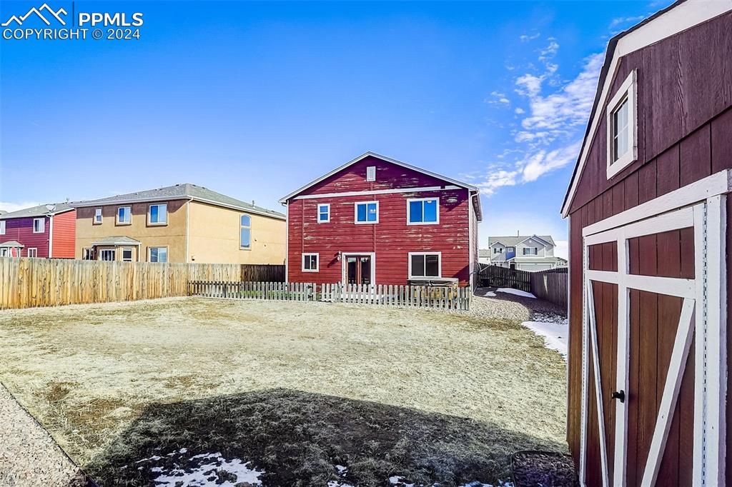 11642 Avena Road Peyton, CO 80831 - Photo 44 of 50 a view of a house with a yard