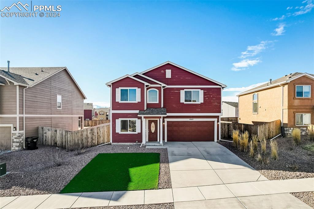 11642 Avena Road Peyton, CO 80831 - Photo 45 of 50 a front view of a house with a yard