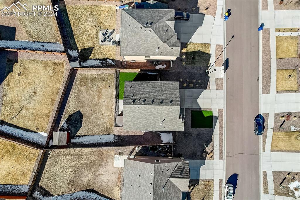 11642 Avena Road Peyton, CO 80831 - Photo 49 of 50 a living room with furniture and a mirror
