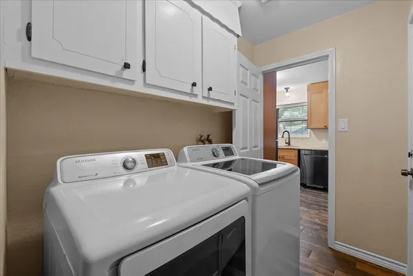 a utility room with dryer and washer