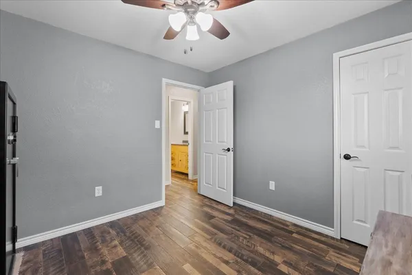 a view of an empty room and wooden floor