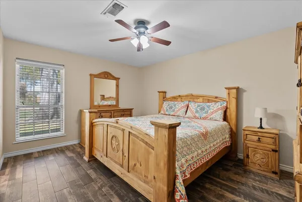 a bedroom with a bed and a view of bedroom