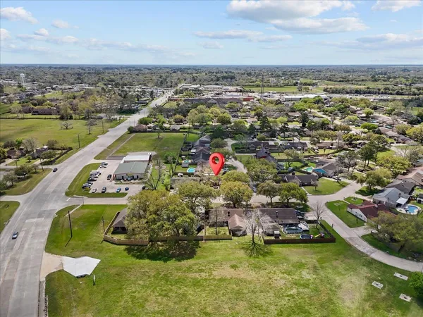 an aerial view of residential houses with outdoor space