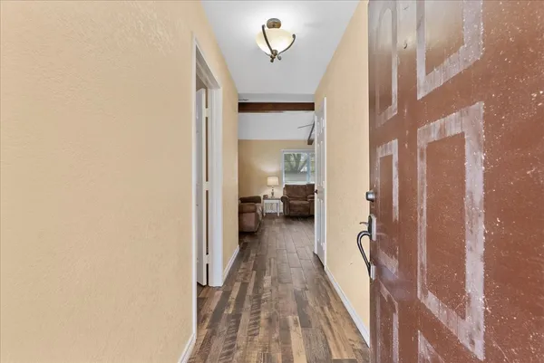 a view of a bedroom from a hallway