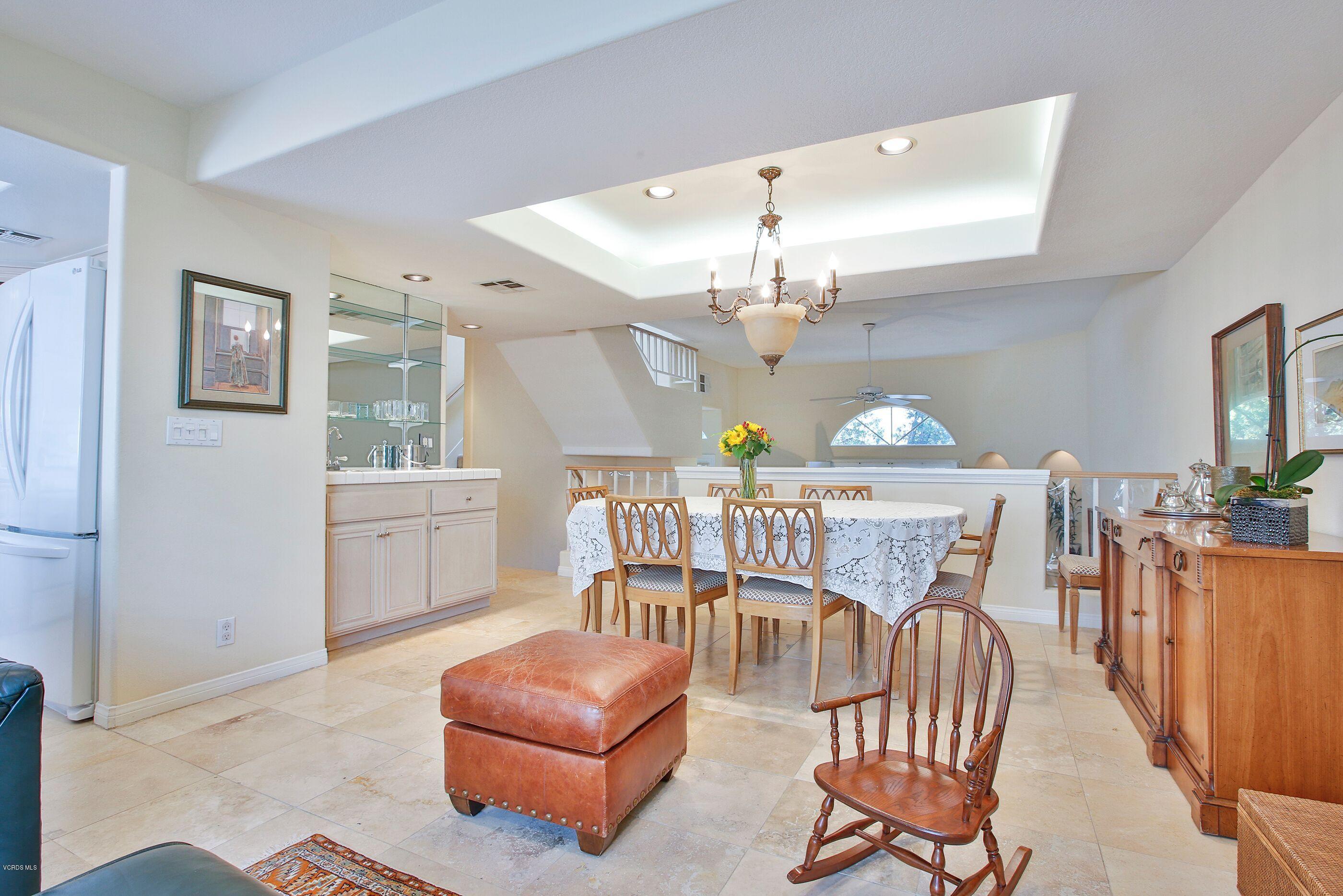 5340 Las Virgenes Road, Unit 11 Calabasas, CA 91302 - Photo 11 of 19 a living room with furniture and a chandelier