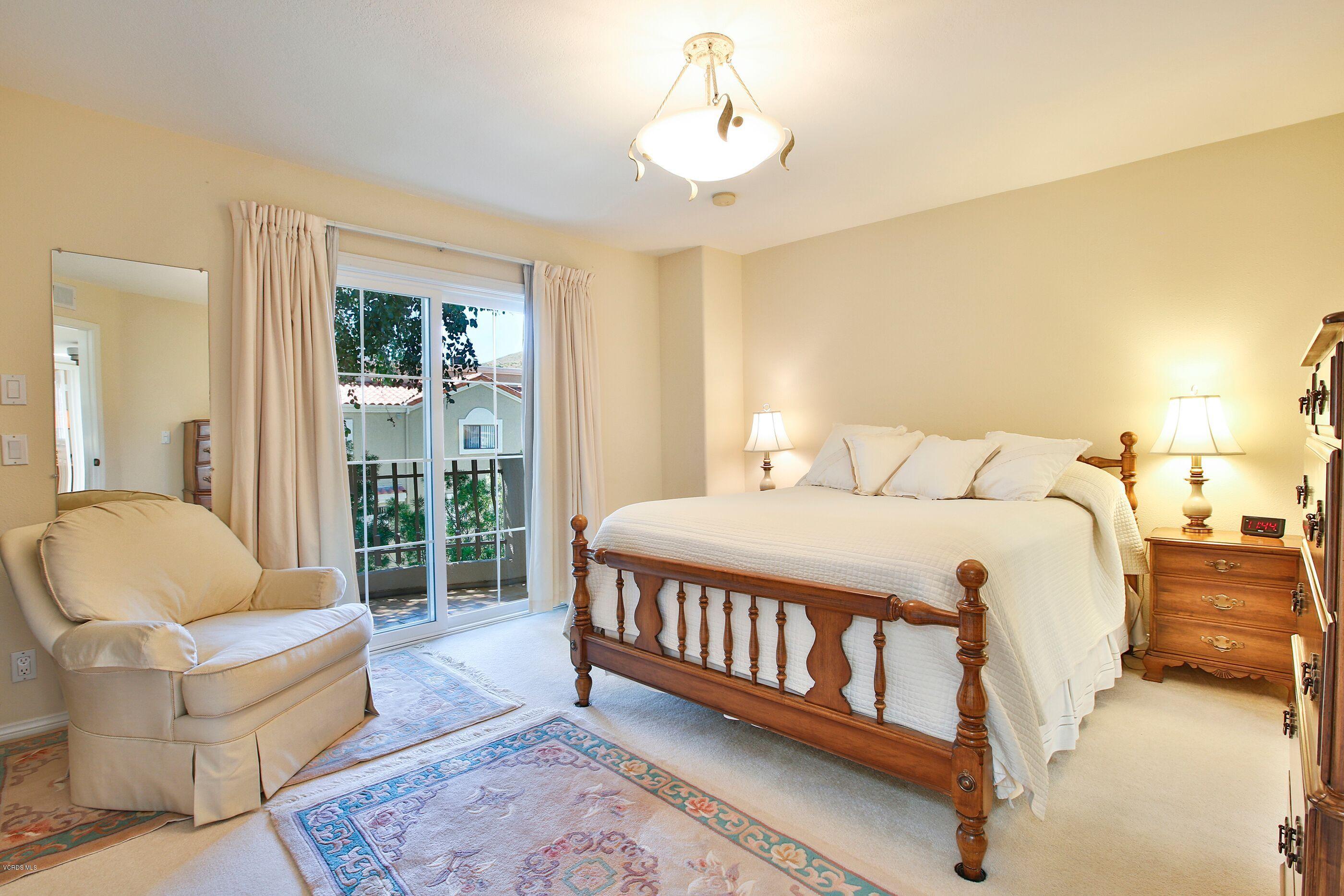 5340 Las Virgenes Road, Unit 11 Calabasas, CA 91302 - Photo 13 of 19 a bedroom with a bed and a couch