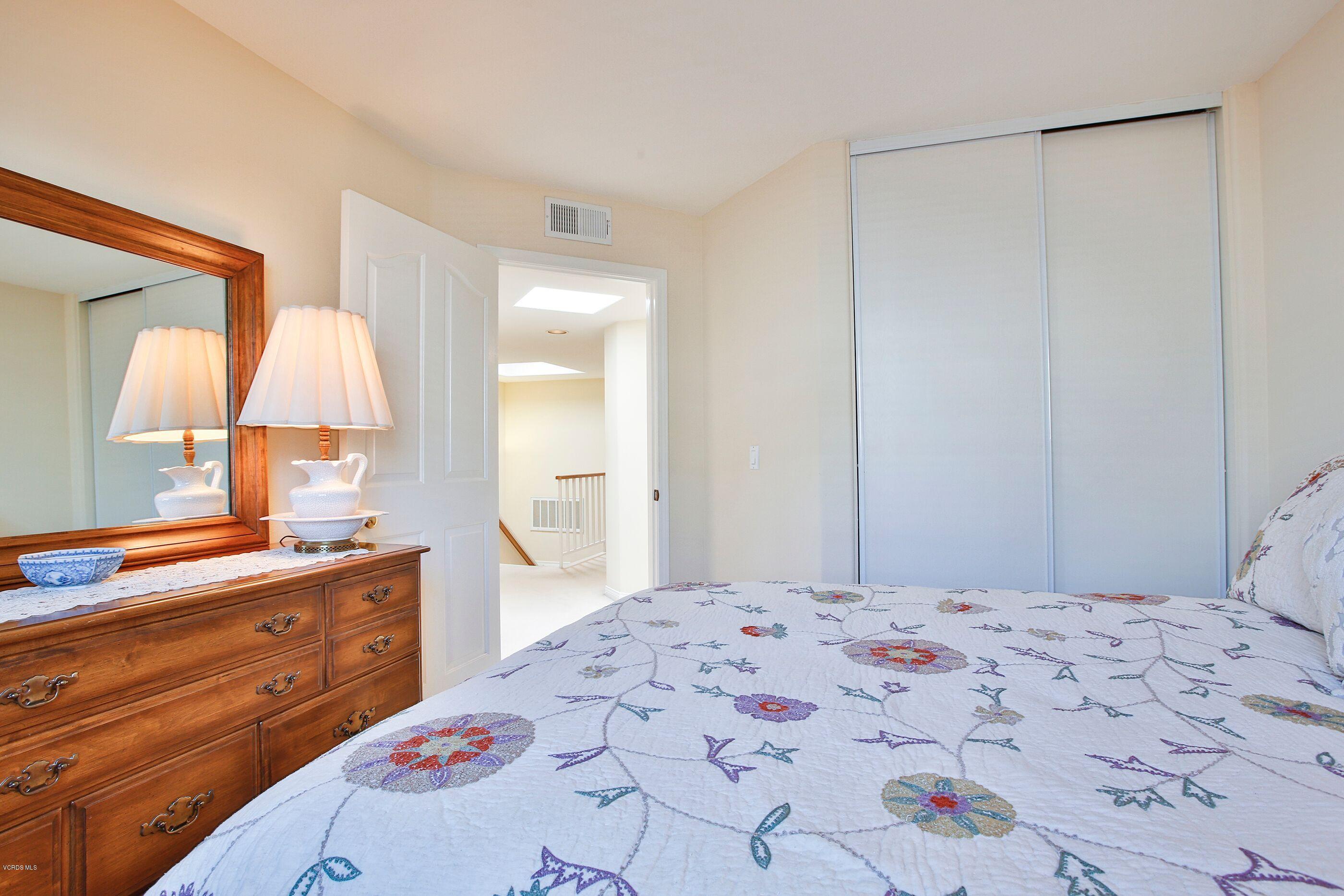 5340 Las Virgenes Road, Unit 11 Calabasas, CA 91302 - Photo 15 of 19 a bedroom with a bed and a closet