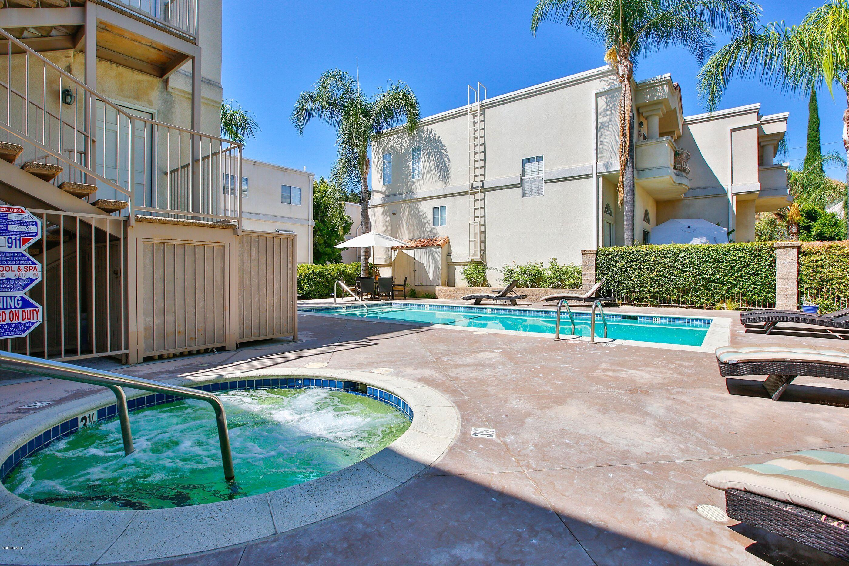 5340 Las Virgenes Road, Unit 11 Calabasas, CA 91302 - Photo 18 of 19 a view of a backyard with plants and a patio