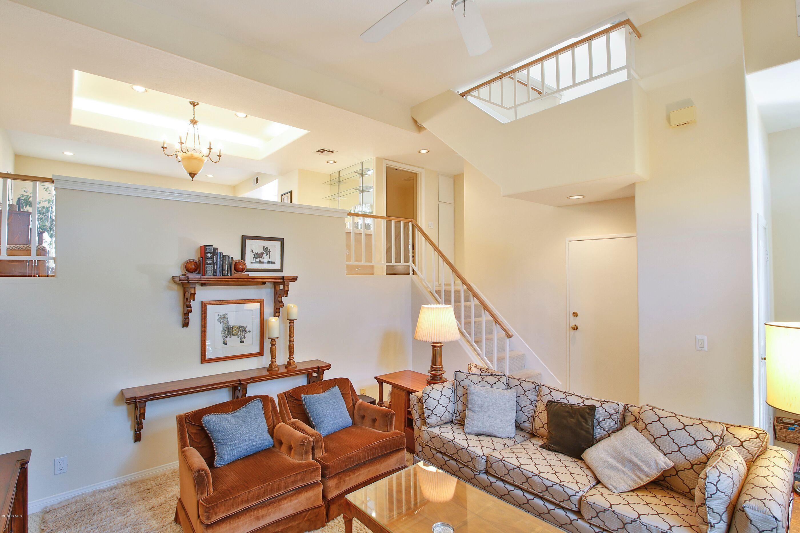 5340 Las Virgenes Road, Unit 11 Calabasas, CA 91302 - Photo 5 of 19 a living room with furniture and a chandelier