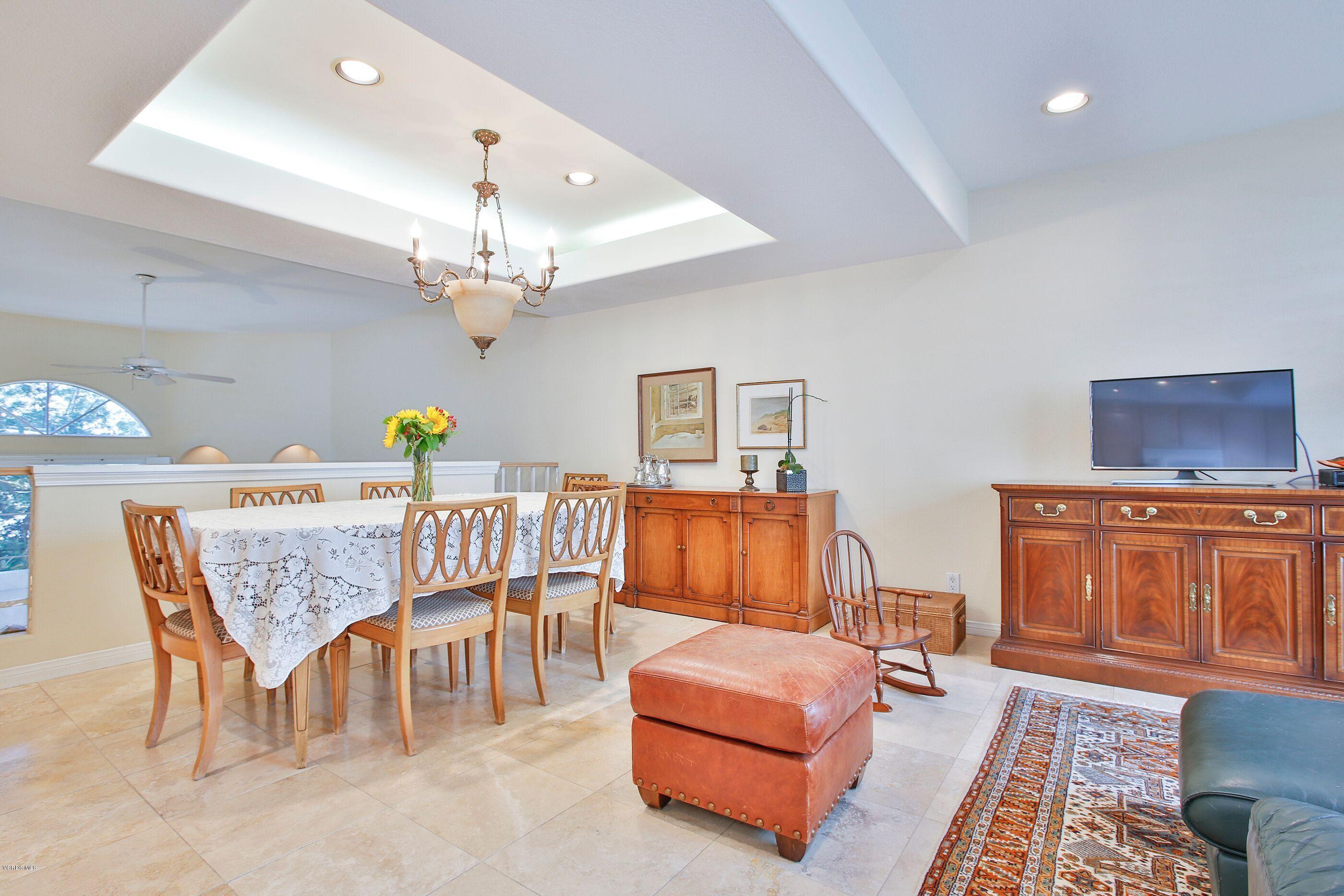 5340 Las Virgenes Road, Unit 11 Calabasas, CA 91302 - Photo 6 of 19 a dining room with furniture and a chandelier