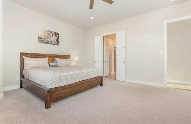 a spacious bathroom with a double vanity sink and a mirror