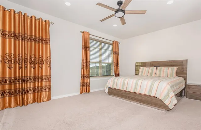 a kitchen with kitchen island granite countertop a sink and a stove top oven with wooden floor
