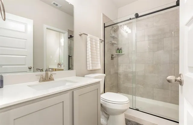 a bedroom with a bed and cabinets