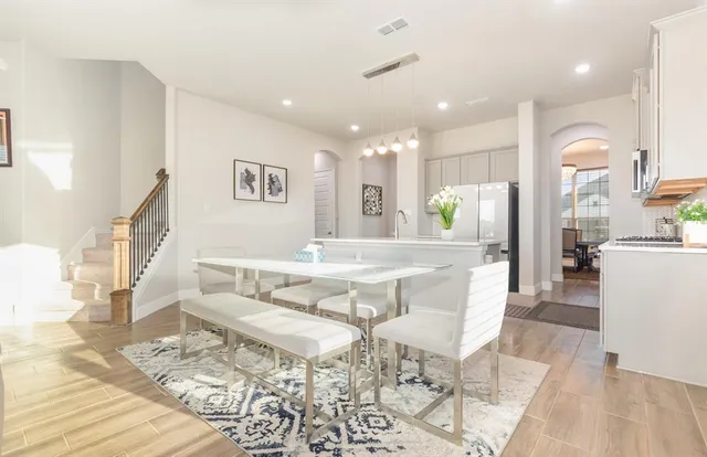 a dining room with a table and chairs