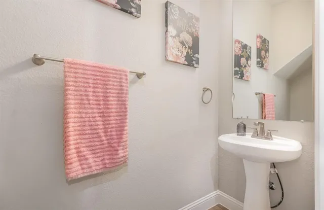 a bathroom with a sink a mirror and a shower