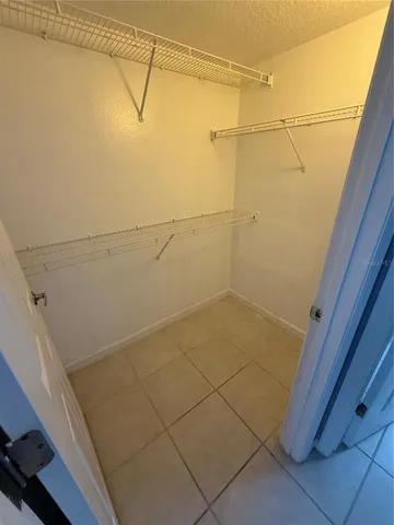 a view of a livingroom with a projector and a window