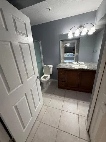 a view of a livingroom with an empty space and a window