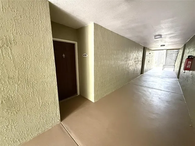 a view of hallway with livingroom