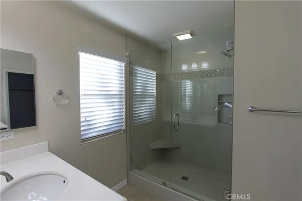 a bathroom with a shower and a toilet