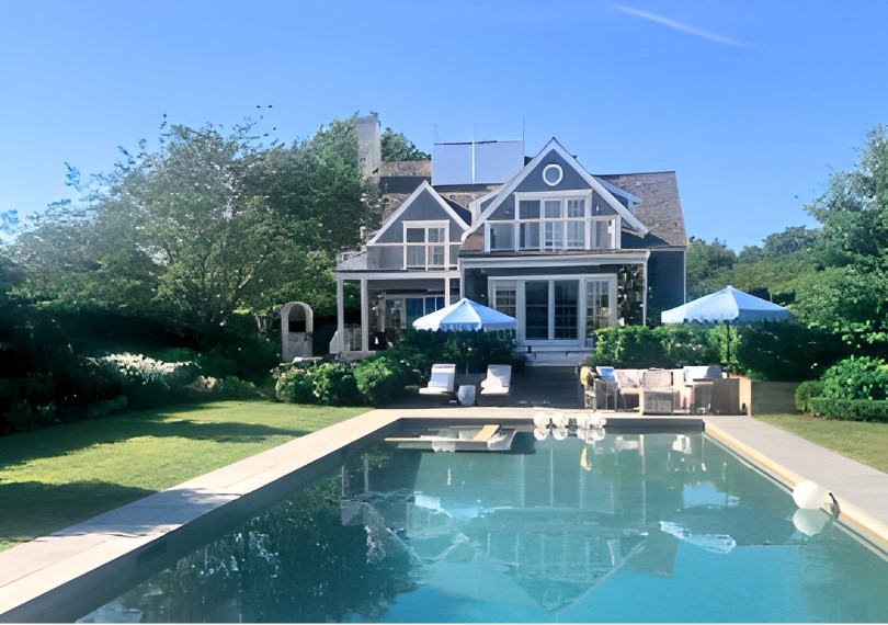 a house with river in front of it