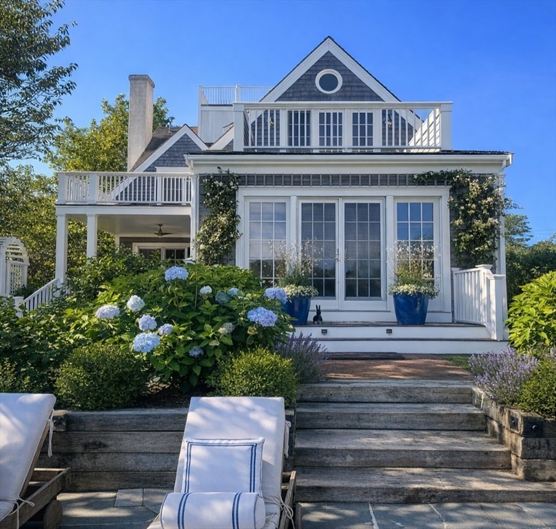 44 Main Street Nantucket, MA 02554 - Photo 24 of 32 a front view of a house with a yard