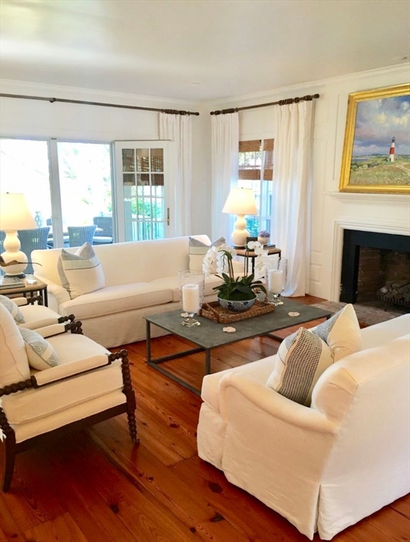 44 Main Street Nantucket, MA 02554 - Photo 6 of 32 a living room with furniture and a fireplace