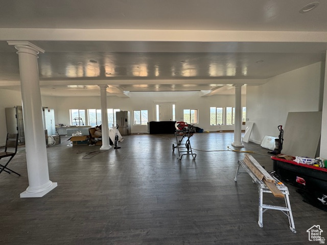 6909 East Spring Drive, Unit 19 Springville, UT 84663 - Photo 8 of 118 Spacious open-concept room featuring multiple windows, recessed ceiling details, and decorative columns