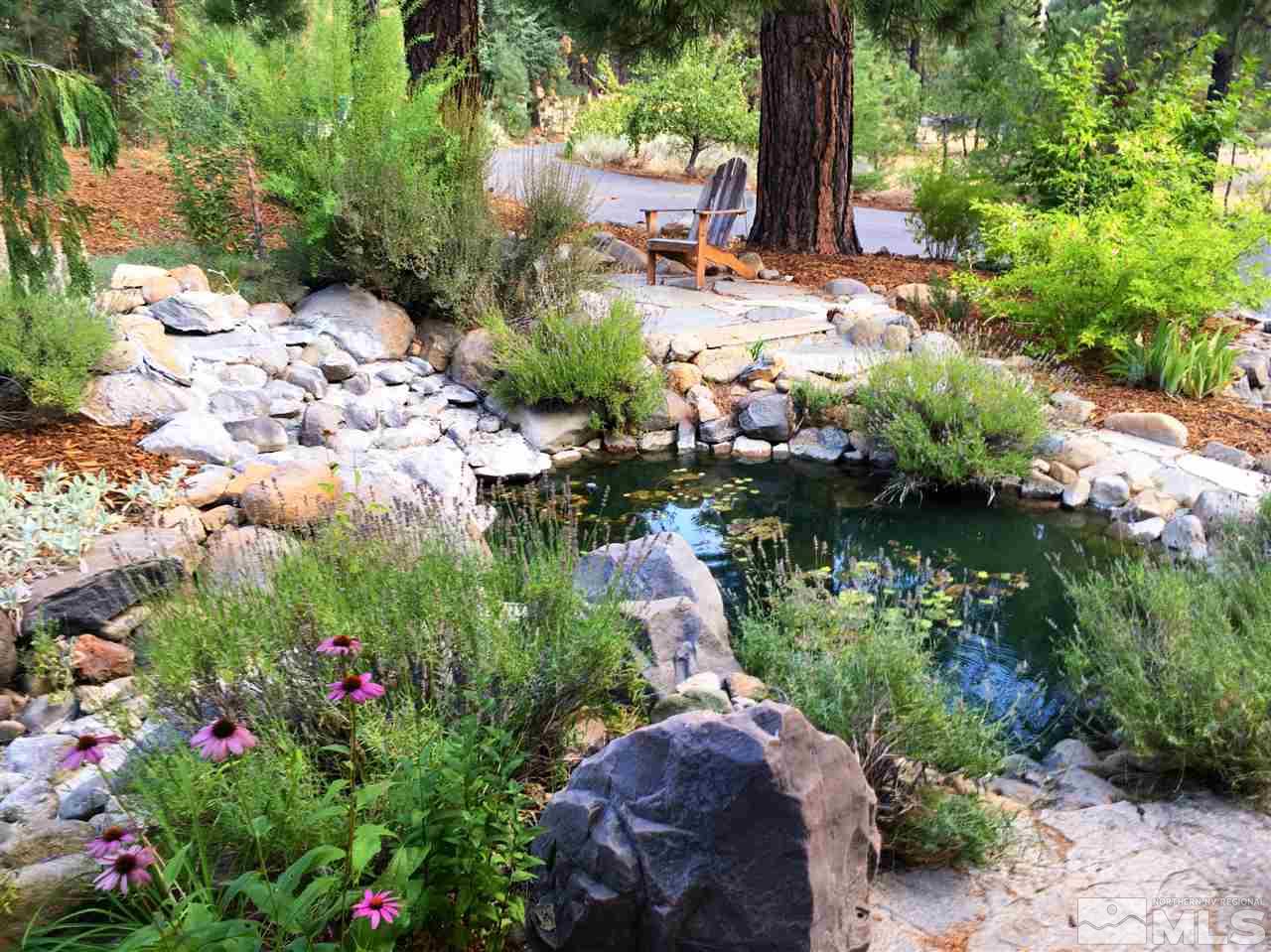 16752 Evergreen Street Reno, NV 89521 - Photo 1 of 1 a view of a garden with a fountain