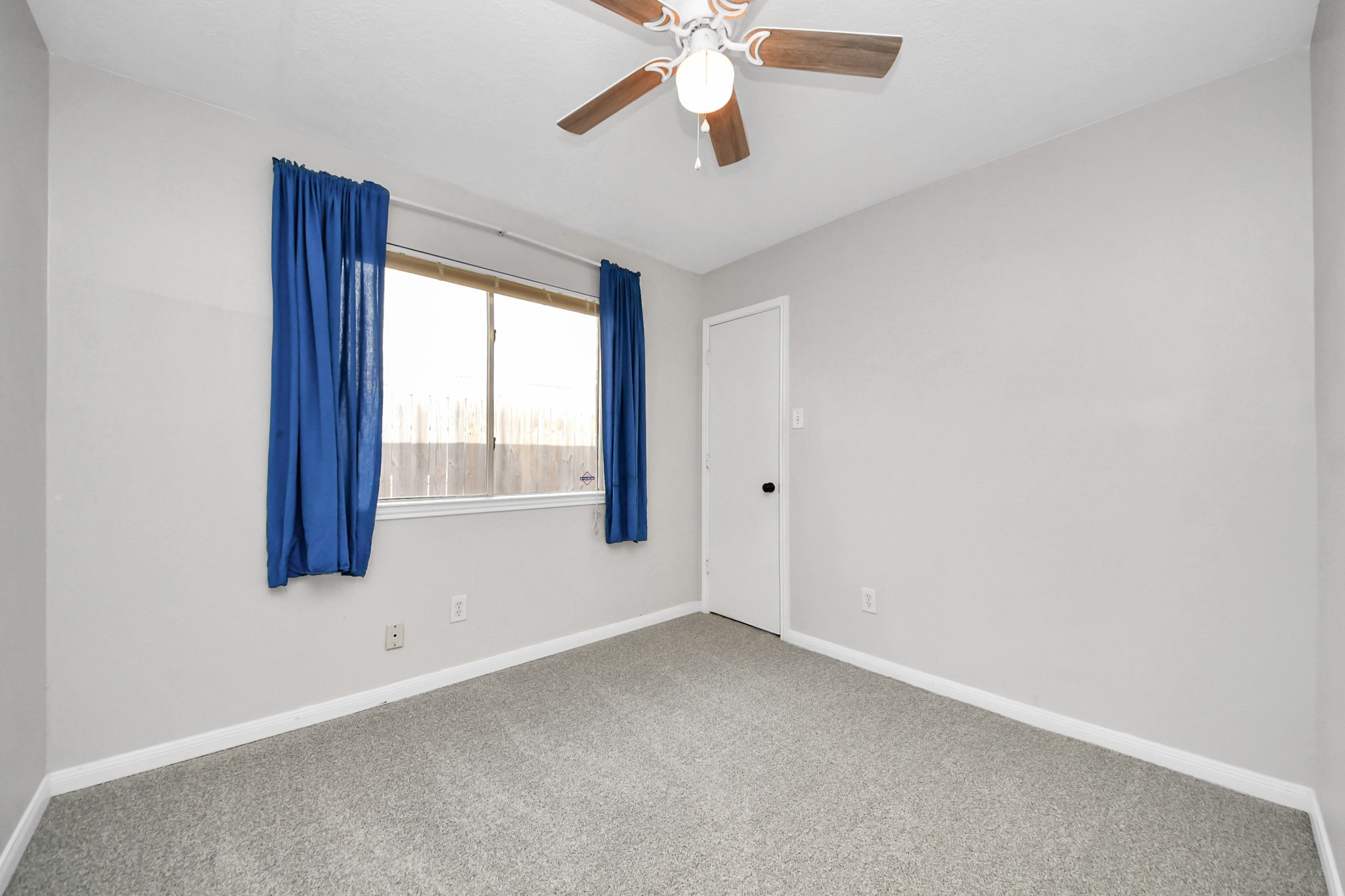 28707 Stapleford Street Spring, TX 77386 - Photo 27 of 38 an empty room with windows and fan