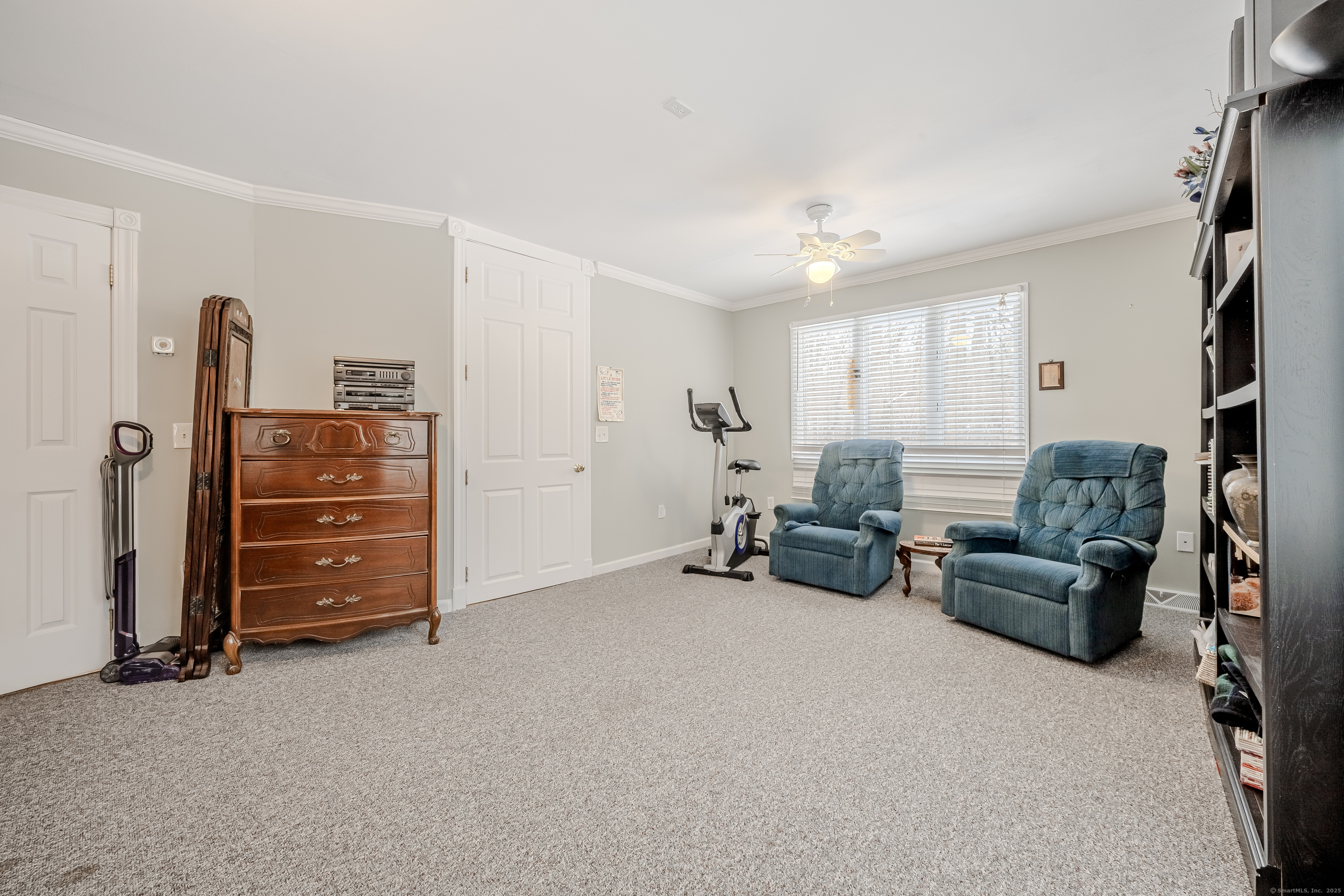 305 Rimmon Road Woodbridge, CT 06525 - Photo 14 of 28 a living room with furniture and a flat screen tv