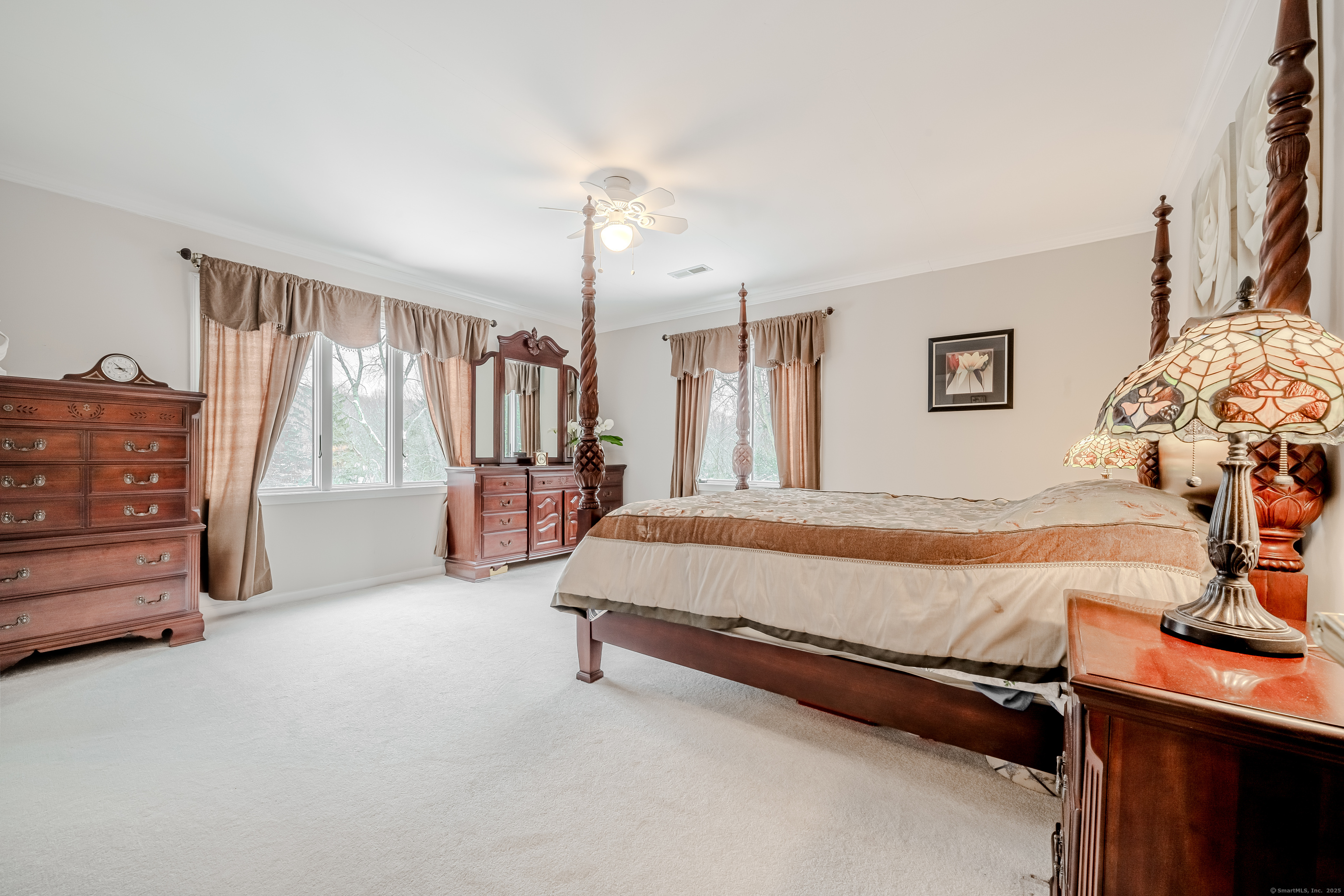 305 Rimmon Road Woodbridge, CT 06525 - Photo 16 of 28 a bed sitting in a room next to a window