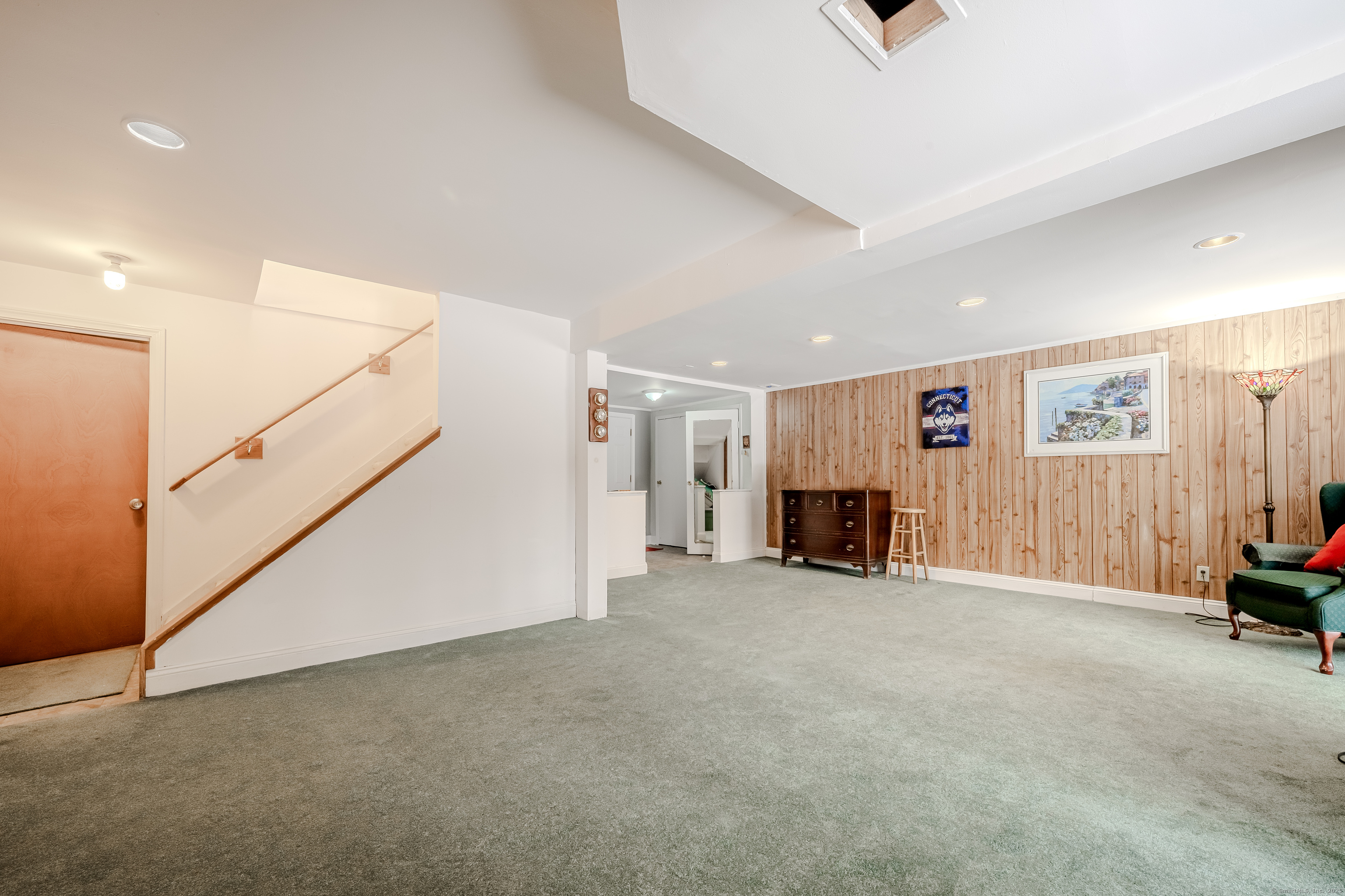 305 Rimmon Road Woodbridge, CT 06525 - Photo 24 of 28 a view of a livingroom with furniture and a ceiling fan