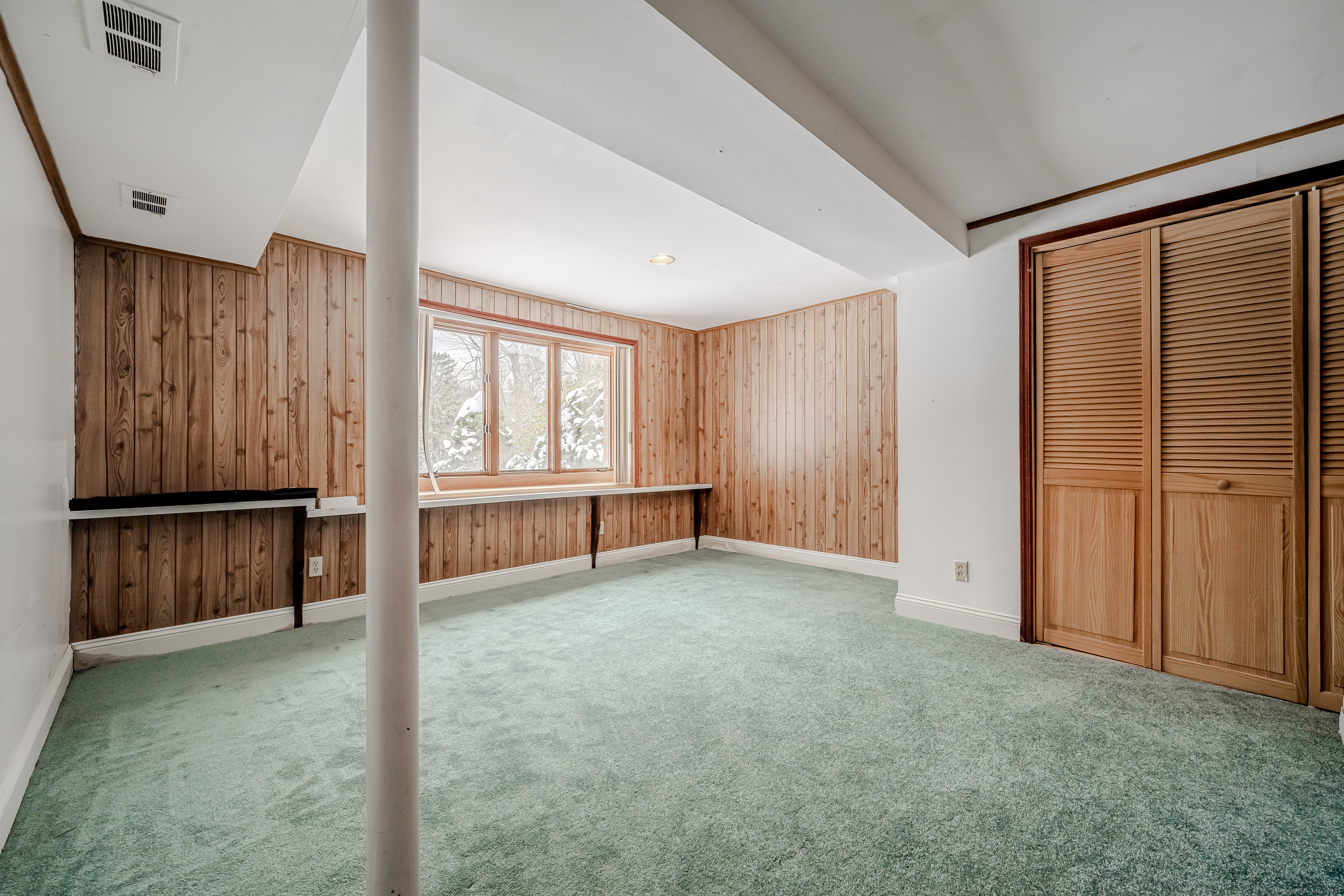 305 Rimmon Road Woodbridge, CT 06525 - Photo 26 of 28 a view of an empty room with a window