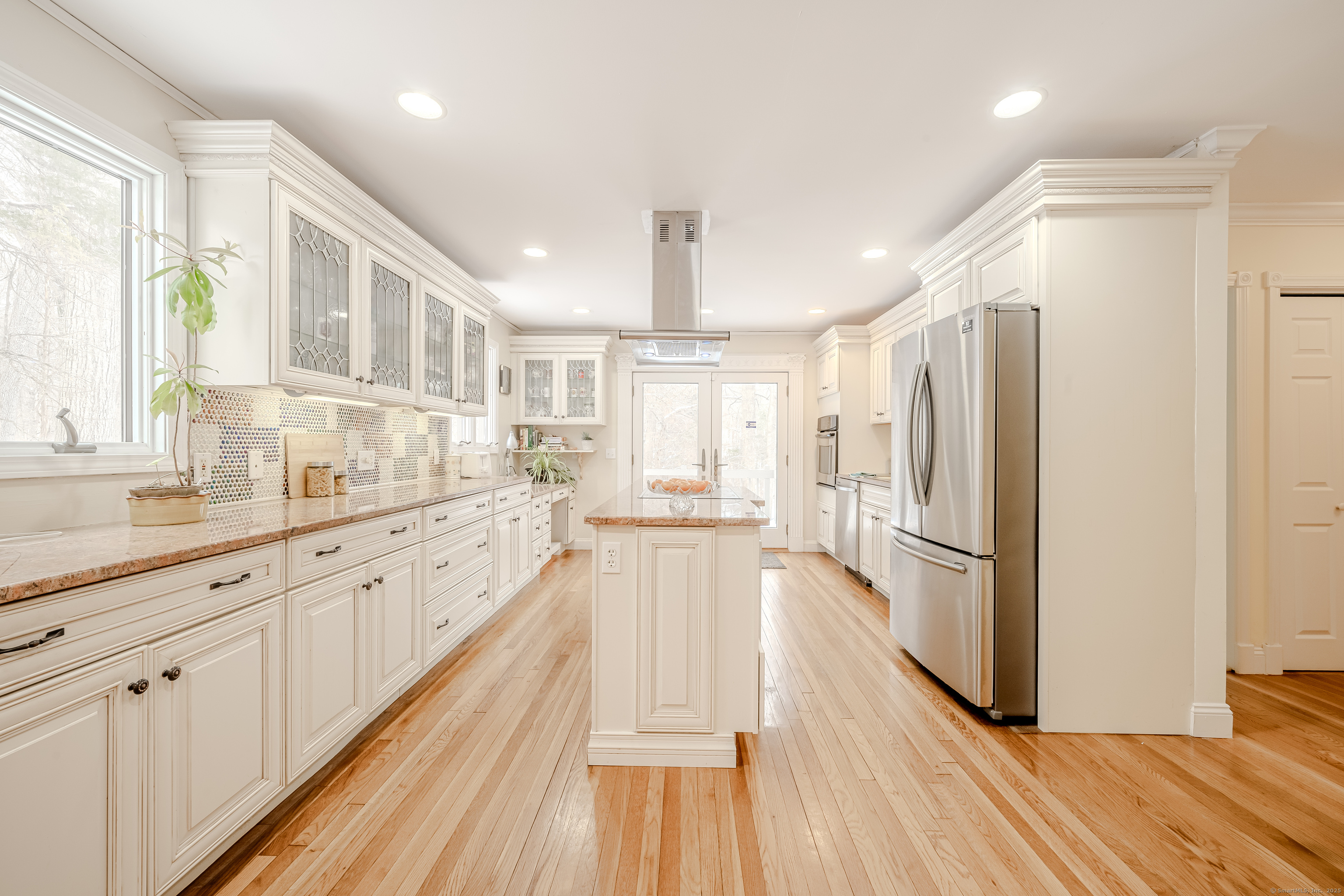 305 Rimmon Road Woodbridge, CT 06525 - Photo 10 of 28 a large kitchen with granite countertop a large counter top space a sink stainless steel appliances and cabinets