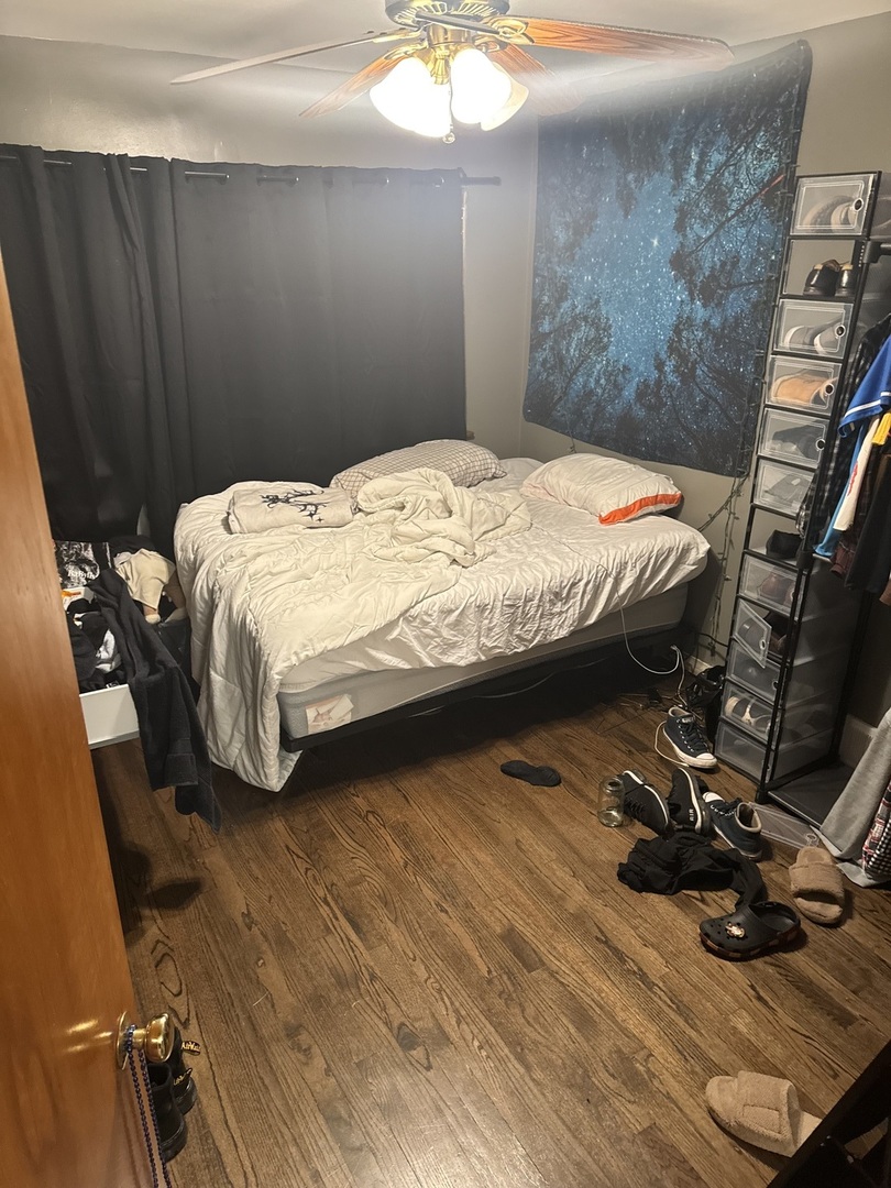3314 South 58th Avenue Cicero, IL 60804 - Photo 11 of 13 a bedroom with a bed and wooden floor