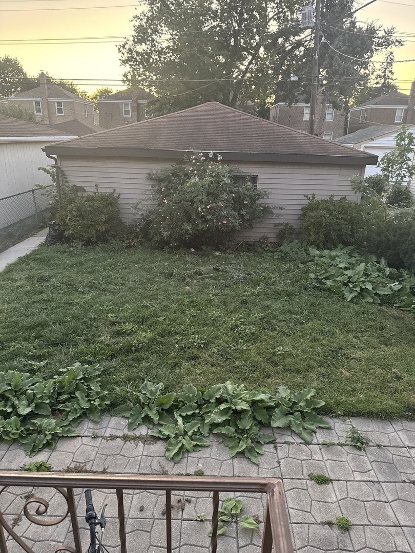 3314 South 58th Avenue Cicero, IL 60804 - Photo 4 of 13 a view of a yard next to a yard