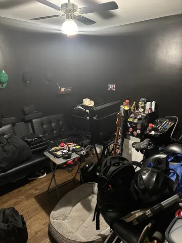 a kitchen with stainless steel appliances a stove a refrigerator a sink dishwasher and a dining table with wooden floor