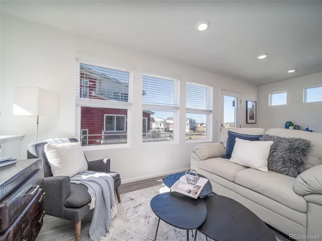 a living room with furniture and a table