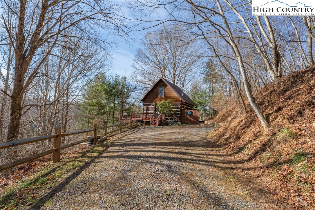 419 Billy Billings Road Vilas, NC 28692 - Photo 39 of 50 a view of house with backyard and trees
