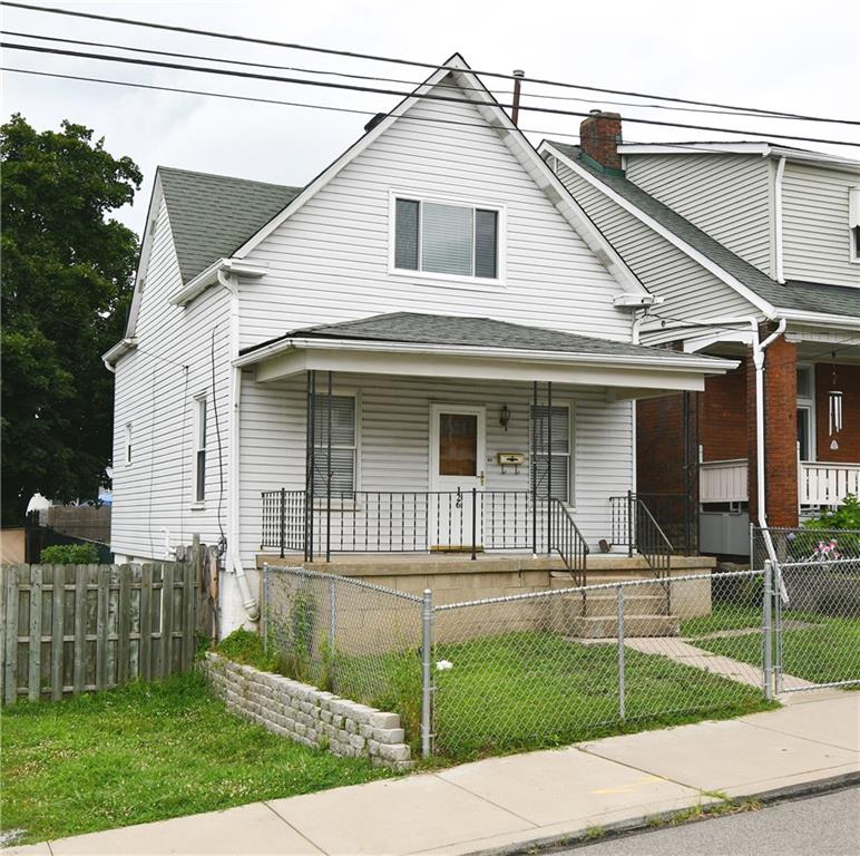 126 Rinne Street Pittsburgh, PA 15210 - Photo 1 of 24 a view of a white house next to a yard