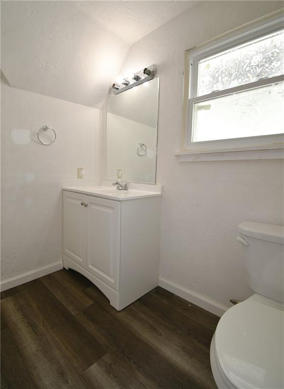 126 Rinne Street Pittsburgh, PA 15210 - Photo 18 of 24 a bathroom with a toilet sink and mirror