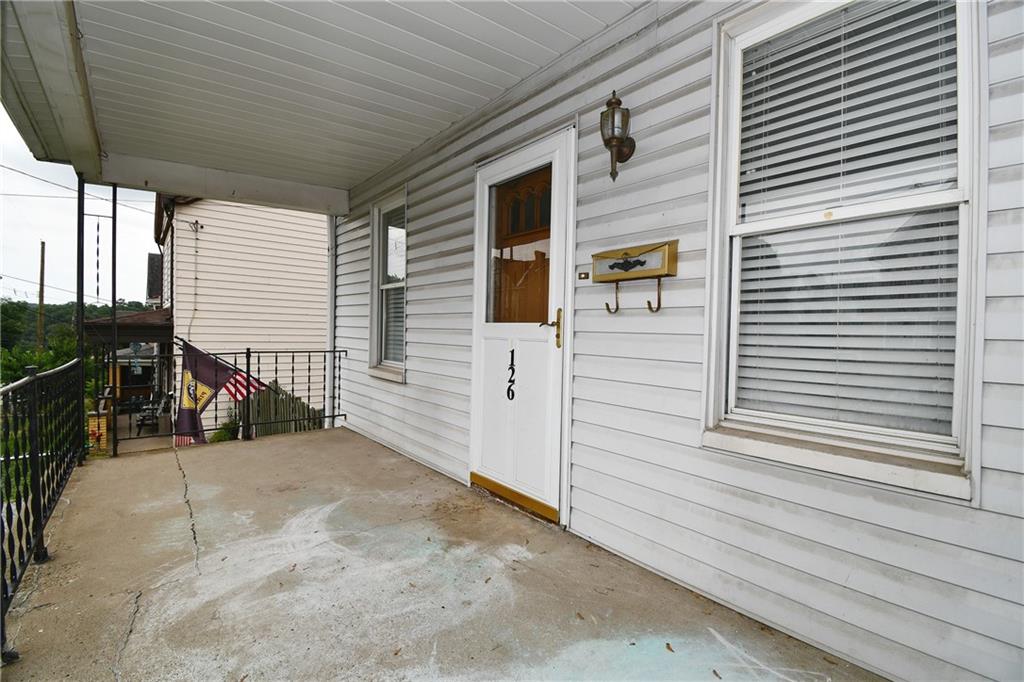 126 Rinne Street Pittsburgh, PA 15210 - Photo 2 of 24 a view of a house with a patio