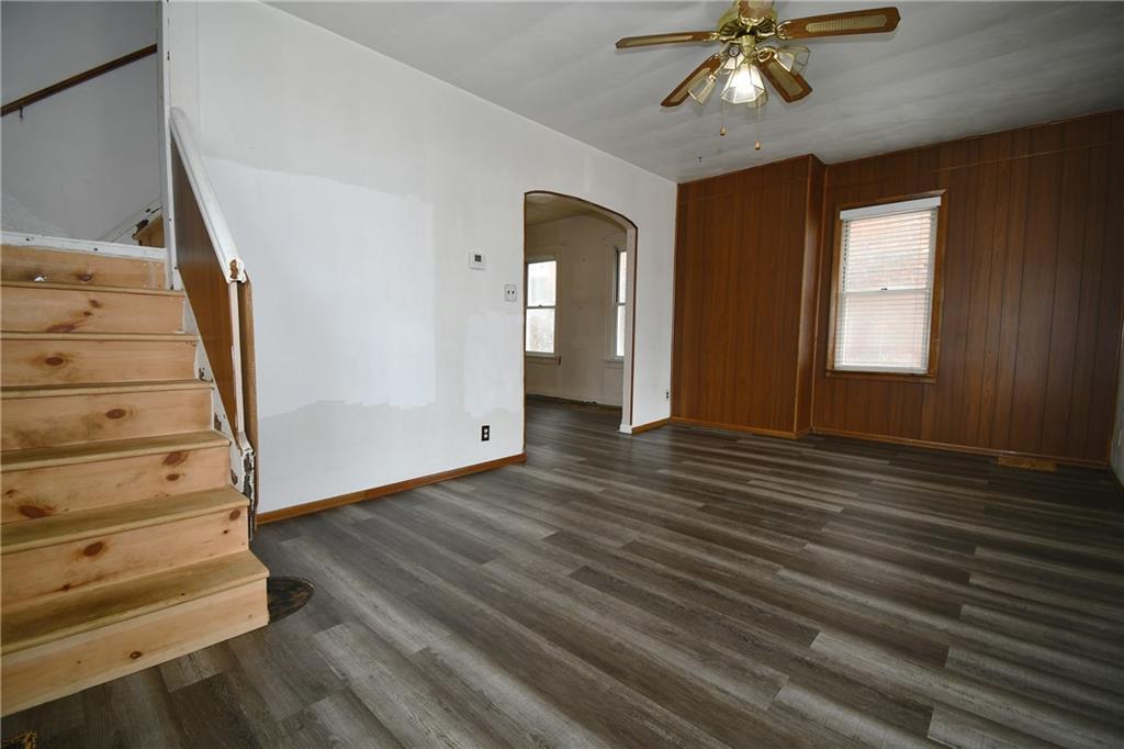 126 Rinne Street Pittsburgh, PA 15210 - Photo 9 of 24 a view of a hallway with wooden floor and staircase