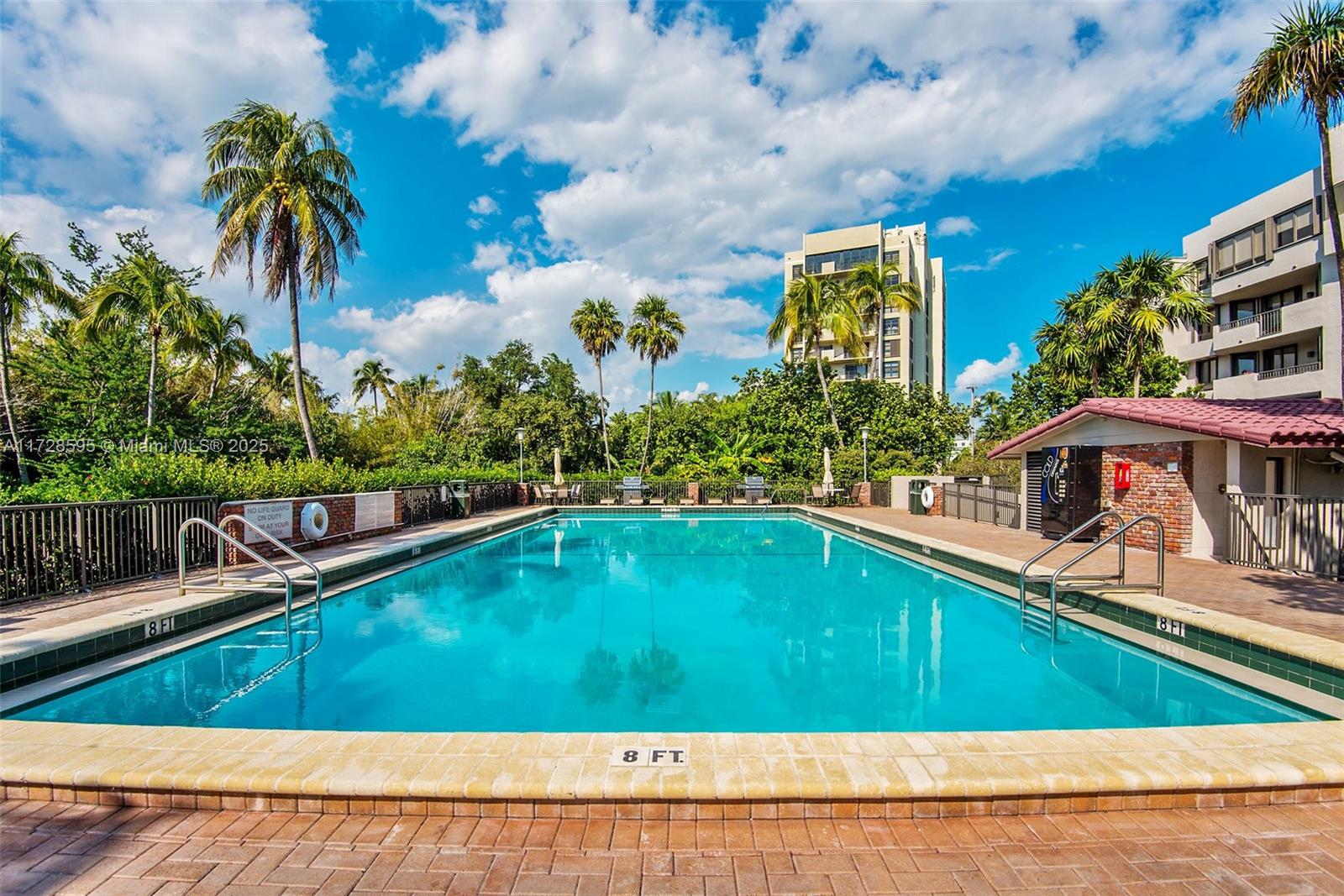141 Crandon Boulevard, Unit 229 Key Biscayne, FL 33149 - Photo 26 of 30 a view of a swimming pool with a yard
