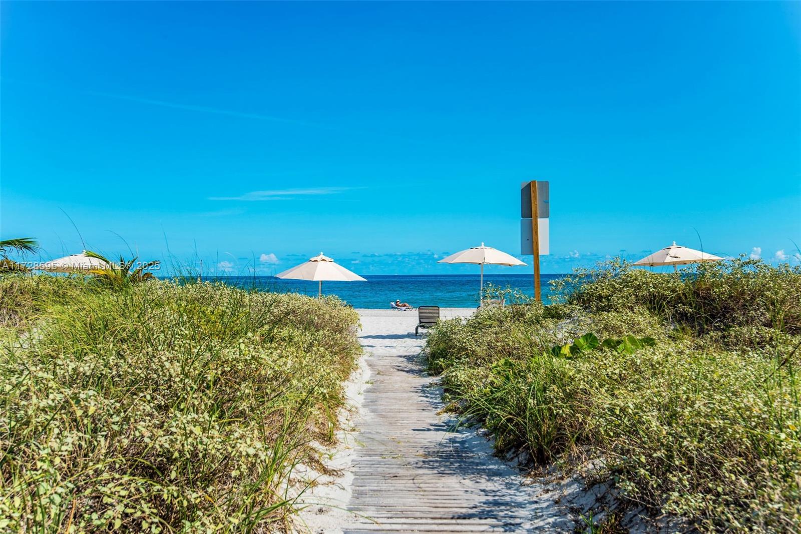 141 Crandon Boulevard, Unit 229 Key Biscayne, FL 33149 - Photo 30 of 30 a sign board with a house in the background