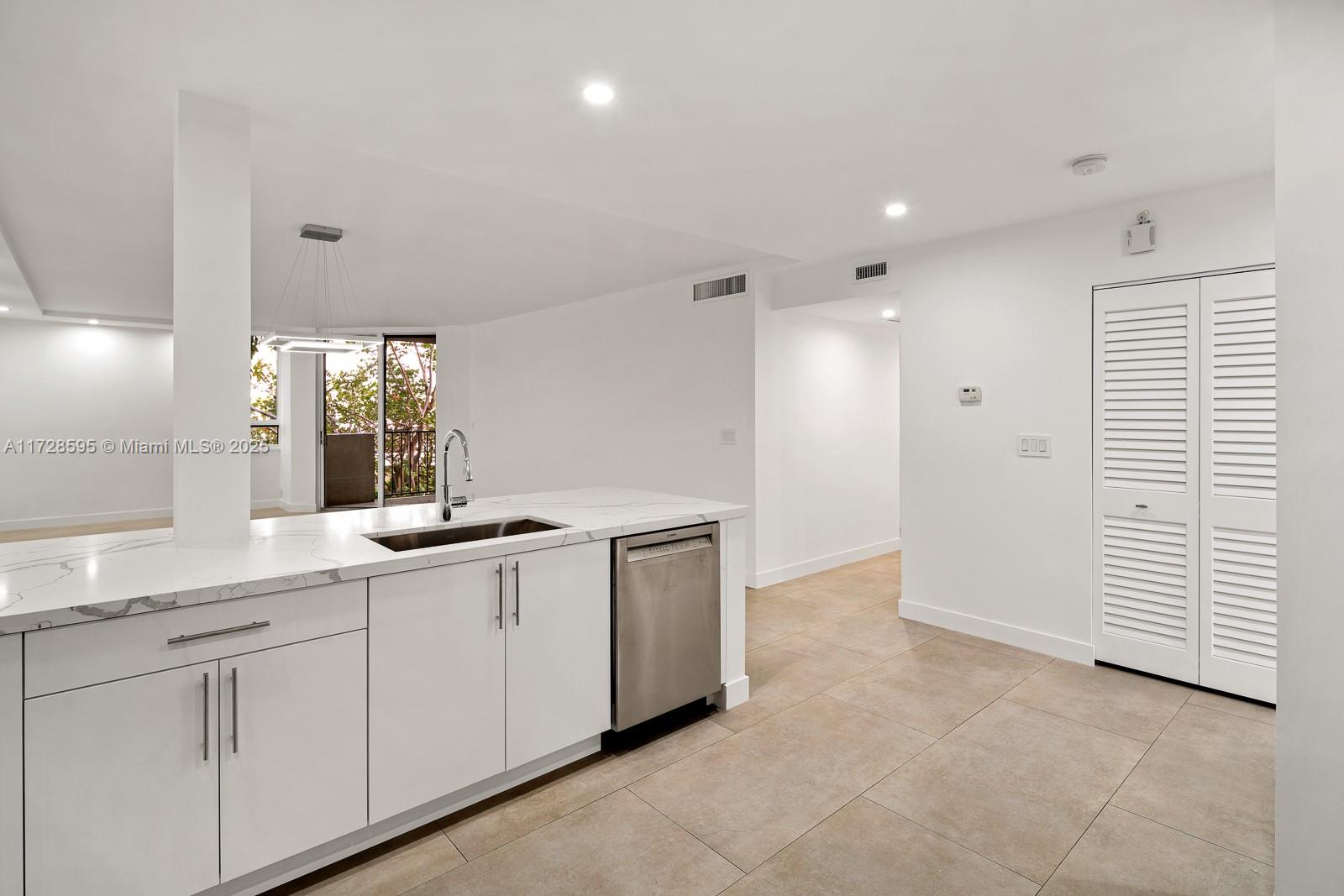 141 Crandon Boulevard, Unit 229 Key Biscayne, FL 33149 - Photo 3 of 30 a view of a kitchen with a sink